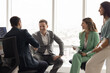© fizkes - Happy successful male business colleagues shaking hands on team meeting, smiling, discussing partnership, collaboration, teamwork, giving handshake due to successful project start