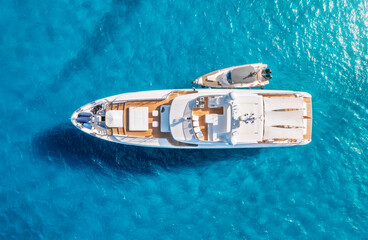 Wall Mural - aerial view of beautiful luxury yacht and boat in blue sea in summer. sardinia, italy. top drone vie