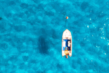 Wall Mural - aerial view of beautiful boat in blue sea in summer at sunset. sardinia, italy. top drone view of bo