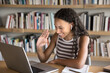 © fizkes - Virtual meeting for studying. Smiling teen girl student in earbuds learning on distance greet teacher tutor via videocall wave hand make welcoming gesture before start online class on notebook screen