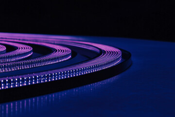 Poster - Illuminated Spiral Path: A mesmerizing close-up of an elegant spiral, crafted with a captivating series of small, luminous dots, creating a sense of wonder and futuristic design.