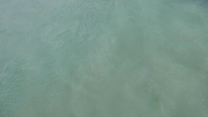 Poster - water is clear and calm. There are no ripples or waves. The water is a deep blue color