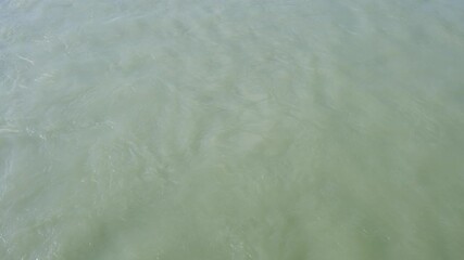 Poster - water is clear and calm. There are no ripples or waves. The water is a deep blue color