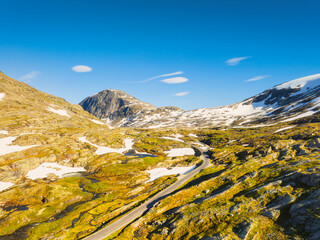 Wall Mural - nature in norway. panoramic aerial view of wild norway. road among the rocks and mountains. bright s