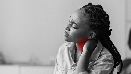 Poster - Tired black businesswoman suffering from neck pain after working on new project at office, copy space