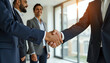 © Leah - businessmen shaking hands