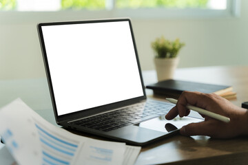 Poster - businessman is sitting at a desk in a modern office with a laptop. the laptop screen is blank