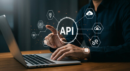 person using laptop with api interface and icons representing cloud computing and data security show