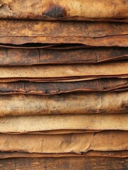 Poster - Stack of Rustic Leather Hides Showing Texture and Grain in Warm Tones for Backgrounds and Textures
