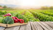© nattapon98 - natural wooden table displays vibrant fresh vegetables, including lettuce, peppers, and cabbage, set against scenic farm