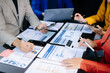 © laddawan - Business people meeting at office writing notes about sticky notes Laptop,tablet  Planning and Brainstorming Strategies