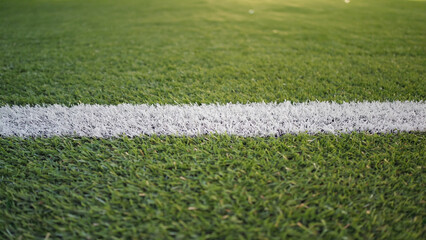 Poster - A soccer field with a white line on the grass, ideal for sports and outdoor scenes