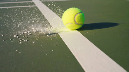Poster - Tennis ball in motion, hitting another tennis ball on a tennis court