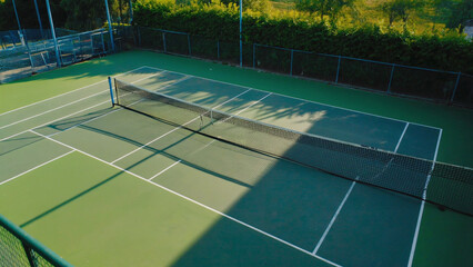 Poster - A simple tennis court with a net, ideal for sports and fitness scenes