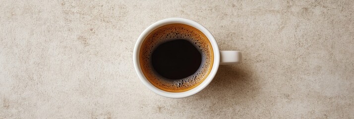 Poster - Elegant top-down view of a white ceramic coffee cup filled with bold espresso against a soft neutral background