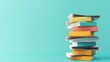 © kwanchanachai - Colorful Stack of Books and Papers on Turquoise Background