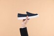 © New Africa - Man with stylish shoe on beige background, closeup
