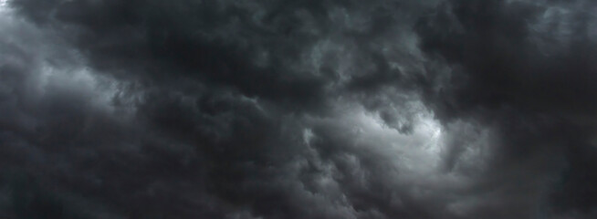 banner dramatic dark storm clouds black sky background. dark thunderstorm clouds rainny season. pano