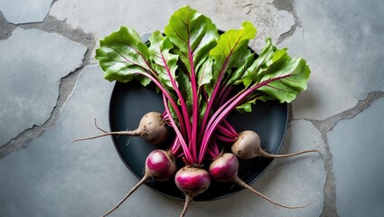 Poster - Bunch of raw organic beets with greens on a gray stone surface