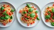©  AugmentArt - Traditional Italian linguini pasta with tomatoes and basil is displayed against a white backdrop. A collection of pasta with tomatoes shown from various angles.