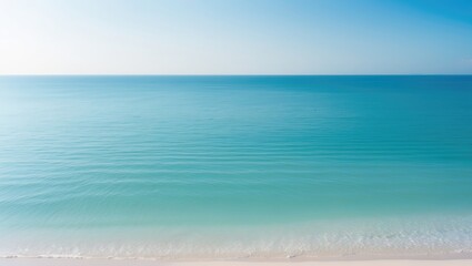 Poster - Beautiful summer landscape view featuring a tropical shore and open sea. The clean and blue sky serves as a background for the calm nature of the ocean waves, with no one around during sunny daytim...