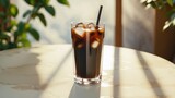 On the table, there is a cup of iced americano coffee.