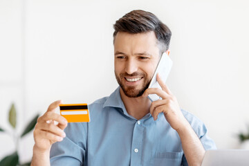 Poster - Mobile Payments. Smiling Businessman Holding Credit Card And Talking On Cellphone In Office, Using Online Banking, Talking With Manager, Paying In Internet, Transfering Money, Booking Vacation