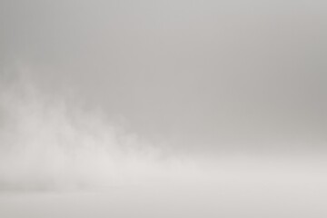 Poster - White smoke is fading on empty background with copy space, creating a mysterious and ethereal atmosphere suitable for various design projects