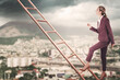 © New Africa - Job search. Woman climbing up wooden ladder against blurred cityscape