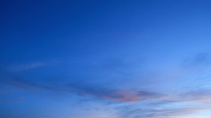 Wall Mural - A time-lapse of the sunset, where the vibrant play of colors creates a romantic backdrop against the moving clouds. Sky cycles and air concept. Timelapse. 4K.

