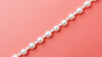 Poster - Round pearls aligned diagonally on salmon pink background, minimal aesthetic with elegance, no people