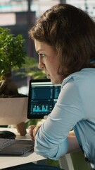 Poster - Vertical video Employee at office desk getting upset after noticing mistake while editing documents, typing on keyboard. Overworked woman distraught by error committed while inputting data on laptop