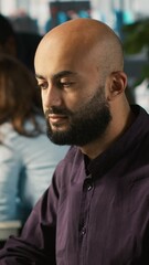 Poster - vertical video happy man in office reviewing financial graphs, pleased after seeing good key perform
