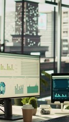 Poster - Vertical video Modern workspace with analytical data paperwork documents in bright office environment with potted plants. Tablet on desk with digital statistics charts displayed on screen, panning