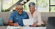 © WestLey/peopleimages.com - Excited, documents and senior couple on sofa in discussion for debt, mortgage or bills payment completed. Happy, investment and elderly man with woman for retirement funds plan with paperwork in home