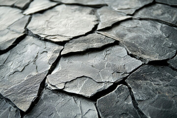 Poster - Close-up of dark gray slate stones forming a textured surface.