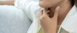 © Shisu_ka - Asian woman put her hand on her neck due to a sore throat. female tonsillitis causes a inflammation. treated by taking water, taking antibiotics, consult a doctor, virus, corona virus, Influenza, flu