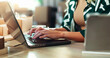 © BuyOutFelix01/peopleimages.com - Hands, laptop and logistics with person in office for delivery or shipping schedule closeup. Computer, supply chain and typing with distribution employee in depot or warehouse for ecommerce tracking