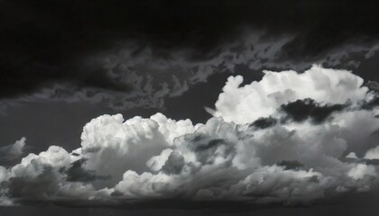 Wall Mural - a black and white photo of a cloudy sky with a few clouds that are white