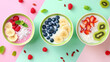 © Titon - Top view of three bowls with colorful smoothies decorated with fresh fruits and berries.