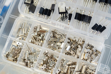 Poster - Electronic components. Set of transistors in plastic cells. Mos transistors of different types. Electronic components for production of microcircuits. Mosfet transistors for digital boards