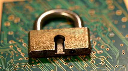 Poster - Metallic padlock resting atop a green computer circuit board with intricate golden patterns suggesting data security.