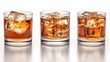 © SerPhoto - Whiskey on the rocks served in three clear glasses with ice cubes during a social gathering at a modern bar setting