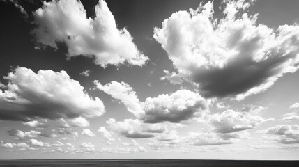 Aufkleber - Dramatic black and white clouds loom over an empty horizon in a minimalist sky landscape