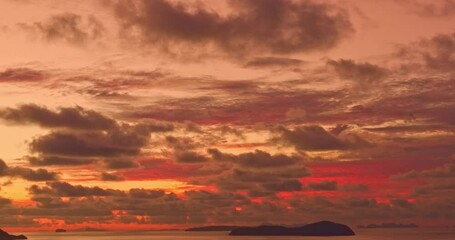 Wall Mural - aerial view of stunning red sky above the islands in sunrise. scene of colorful sky in sunrise at Rawai beach Phuket. amazing sky texture, abstract nature background.