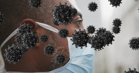 Poster - Image of covid 19 cells over man wearing face mask