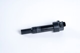 Car ignition coil on white background. Element of car engine.