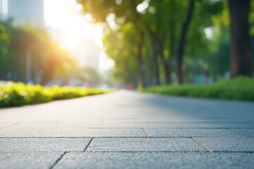 Poster - neatly swept city park pathway with sunlight filtering through trees framed with blurred greenery in