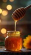 © Aldi - Honey dripping from a dipper into a glass jar of liquid honey