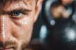 A close-up of a sweaty male athlete's face after a strenuous workout, with intense blue eyes, holding a kettlebell, conveying dedication and perseverance